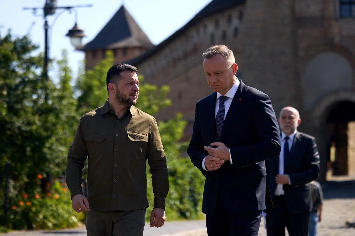 In this handout photograph taken and released by the Ukrainian Presidential Press Service on July 9, 2023, Ukraine's President Volodymyr Zelensky (L) speaks with Poland's President Andrzej Duda (R) during their meeting in Lutsk. (Photo by Handout / UKRAINIAN PRESIDENTIAL PRESS SERVICE / AFP) / RESTRICTED TO EDITORIAL USE - MANDATORY CREDIT "AFP PHOTO / UKRAINIAN PRESIDENTIAL PRESS SERVICE" - NO MARKETING NO ADVERTISING CAMPAIGNS - DISTRIBUTED AS A SERVICE TO CLIENTS