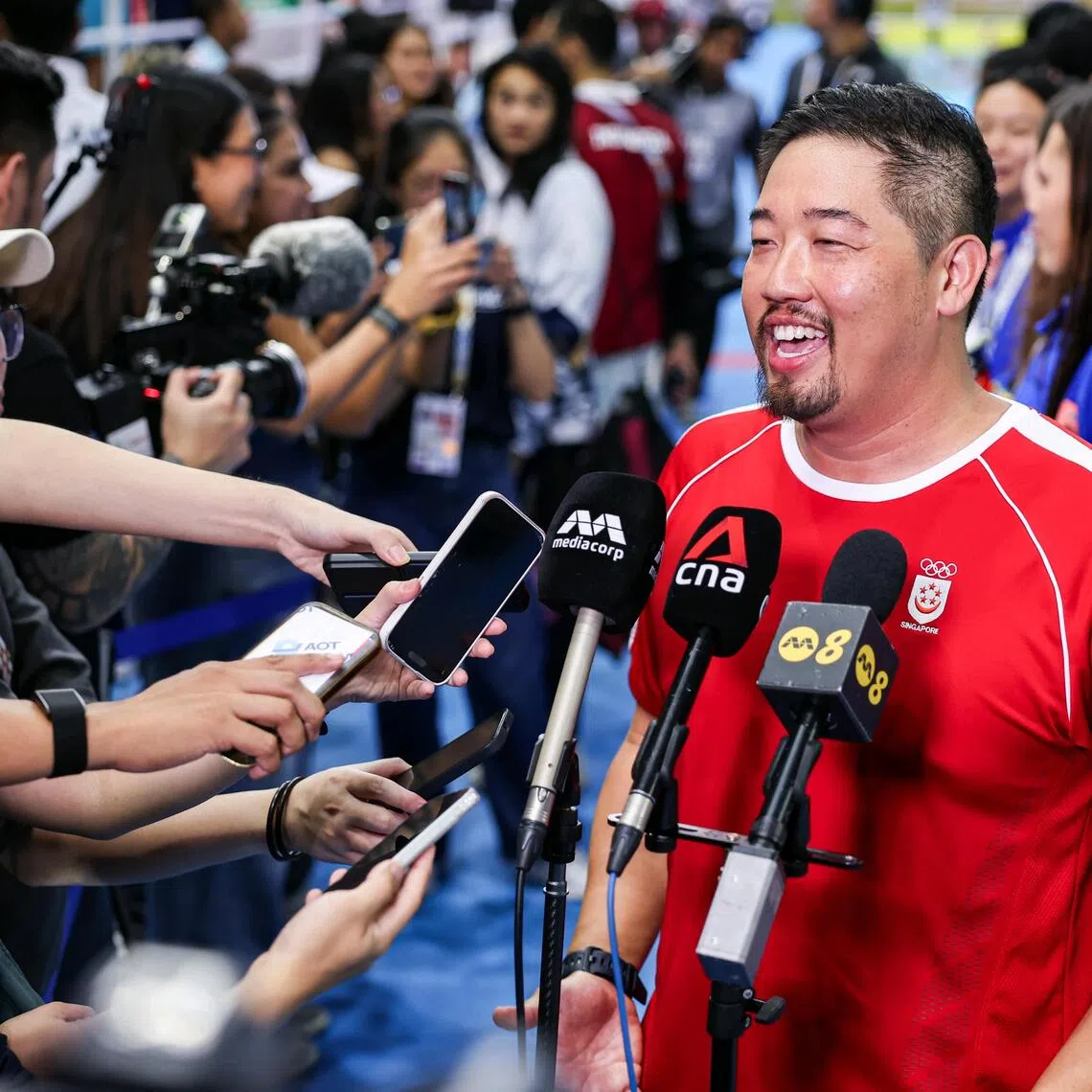 Singapore national team's swimming coach Gary Tan in high spirits at the end of the swimming events at the 33rd SEA Games, held at the SAT swimming pool in Bangkok on Dec 15, 2025. ST PHOTO: BRIAN TEO