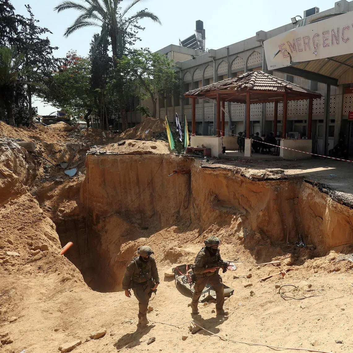 Israeli soldiers walking out from a tunnel underneath a hospital in the Gaza Strip, in June 2025.