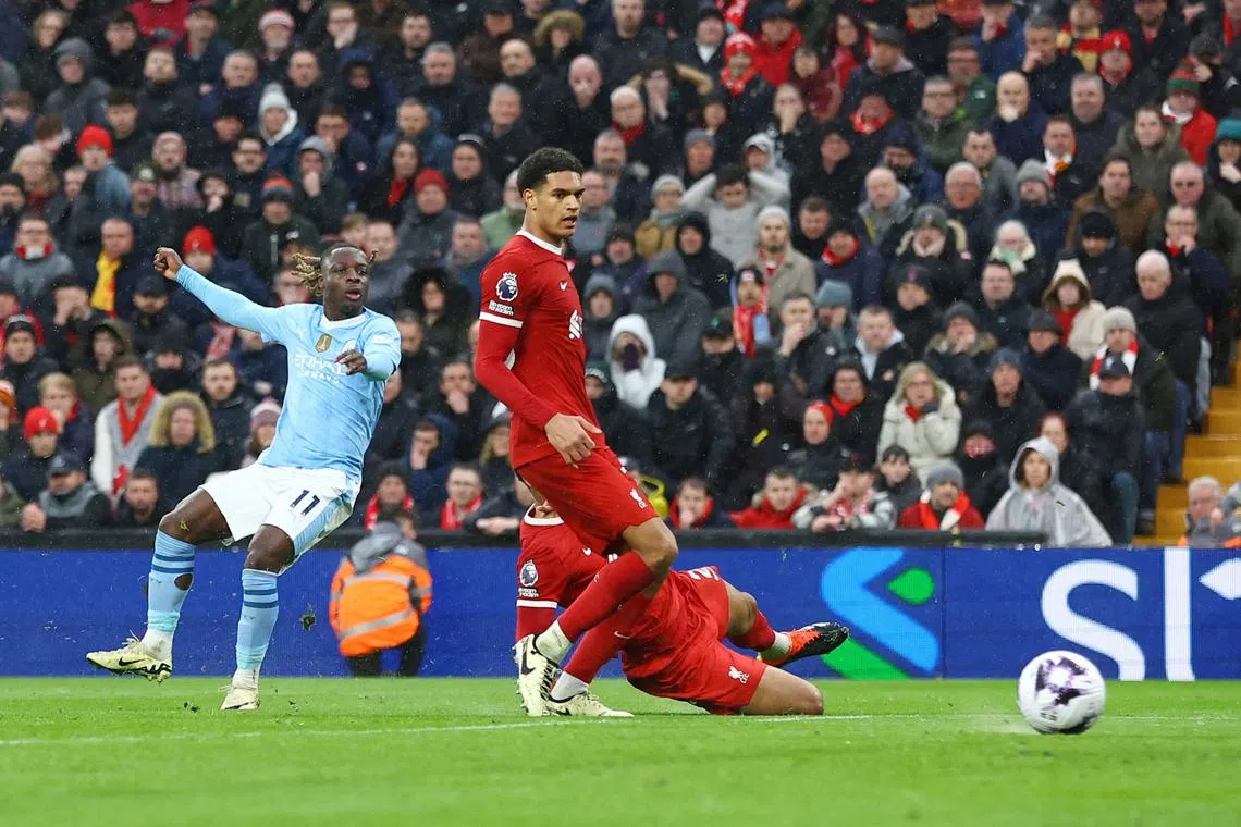 Soccer Football - Premier League - Liverpool v Manchester City - Anfield, Liverpool, Britain - March 10, 2024 Manchester City's Jeremy Doku shoots at goal and hits the post REUTERS/Carl Recine