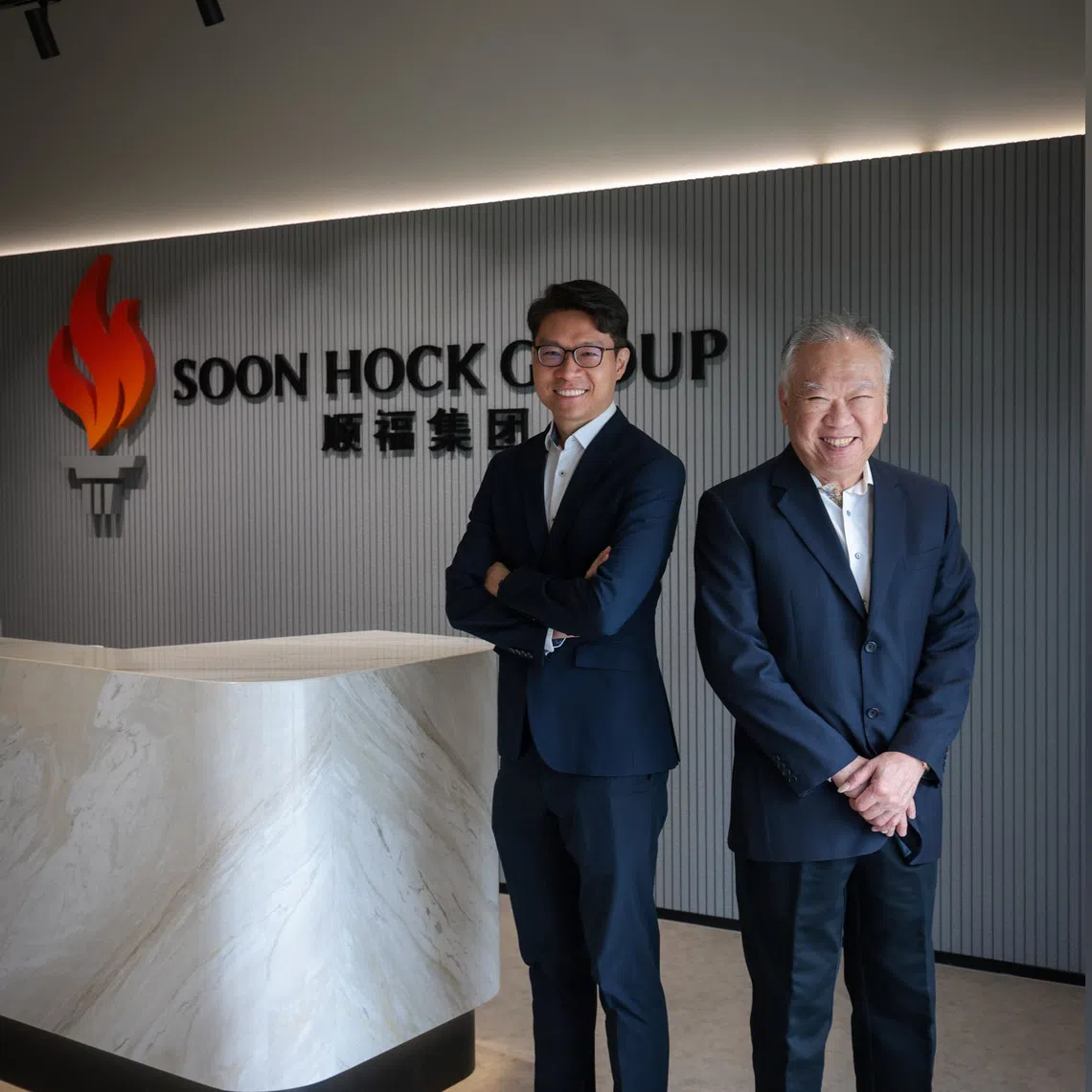Soon Hock Group chief executive Walter Tan (left) and Soon Hock Group executive chairman and founder Tan Yeow Khoon at the company's HQ at Jalan Papan in Jurong West. 
