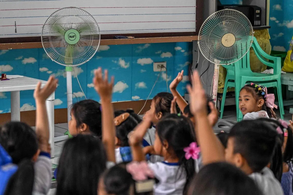 In the Philippines, classes have been rearranged to keep children out of the midday heat.