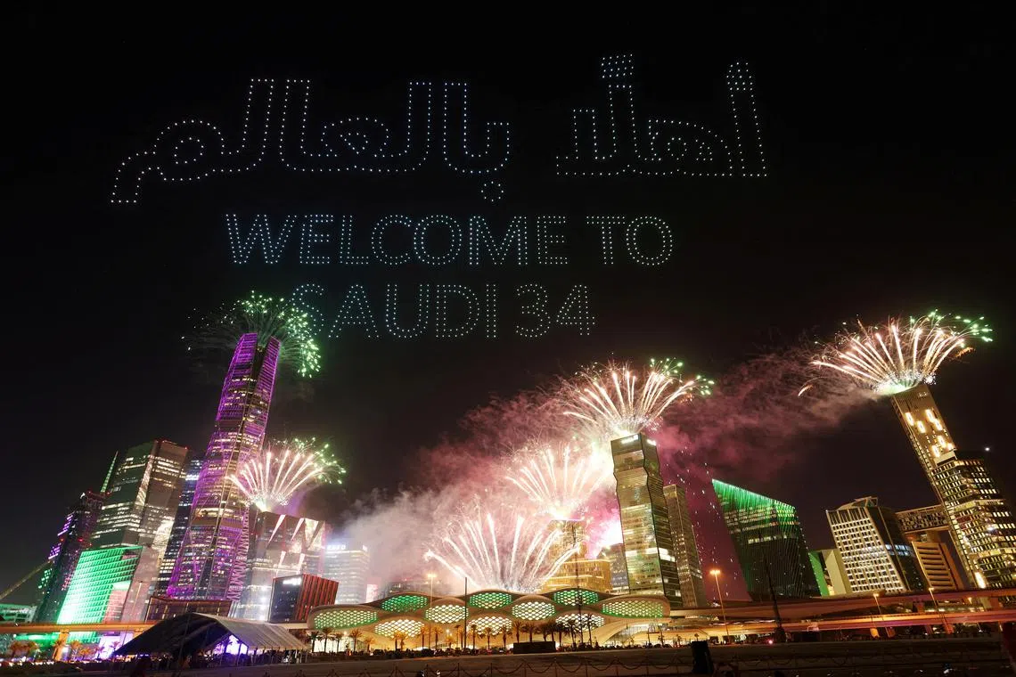 A drone show is seen displaying the words "Welcome to Saudi 34" as Saudi Arabia is announced as the host nation for the Fifa World Cup 2034.
    