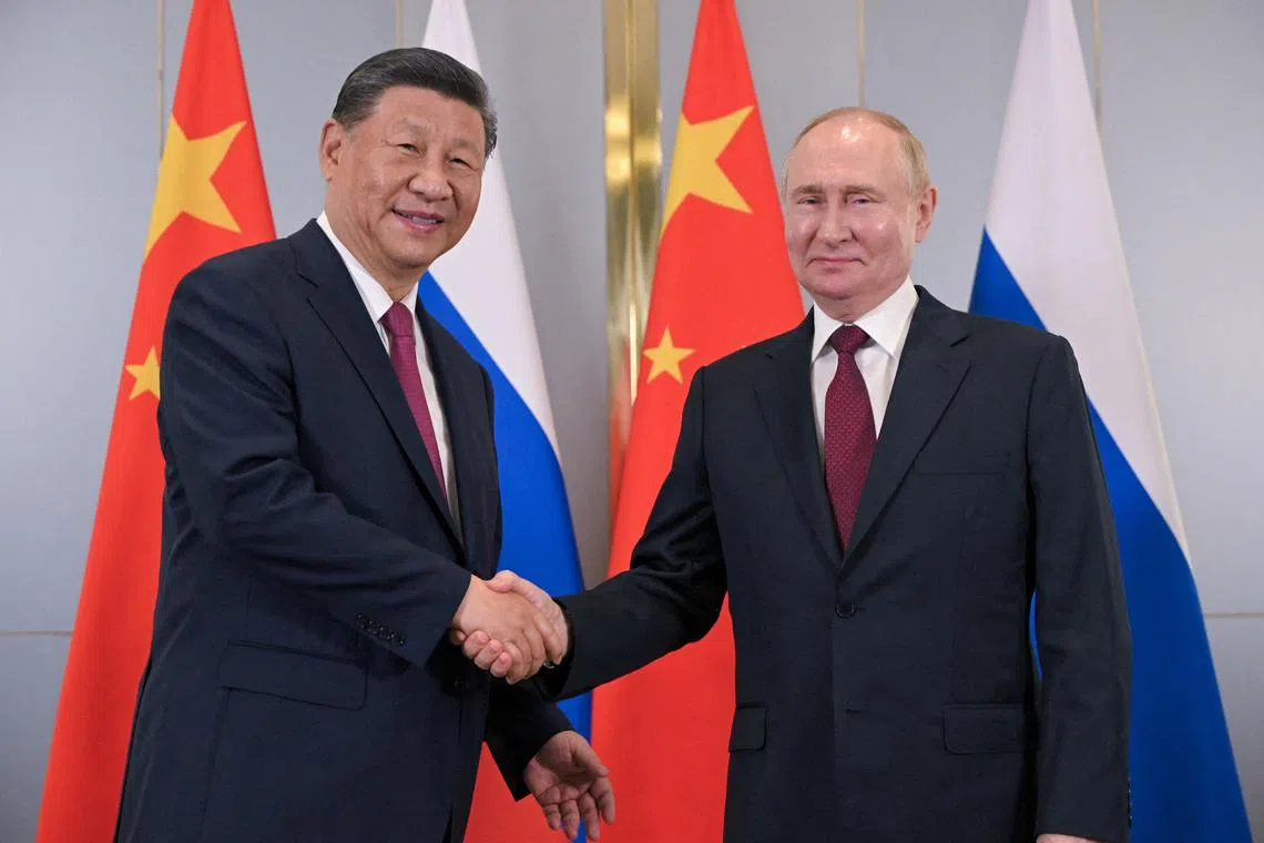 Chinese President Xi Jinping (left) and Russian President Vladimir Putin meeting in Kazakhstan, in July 2024.