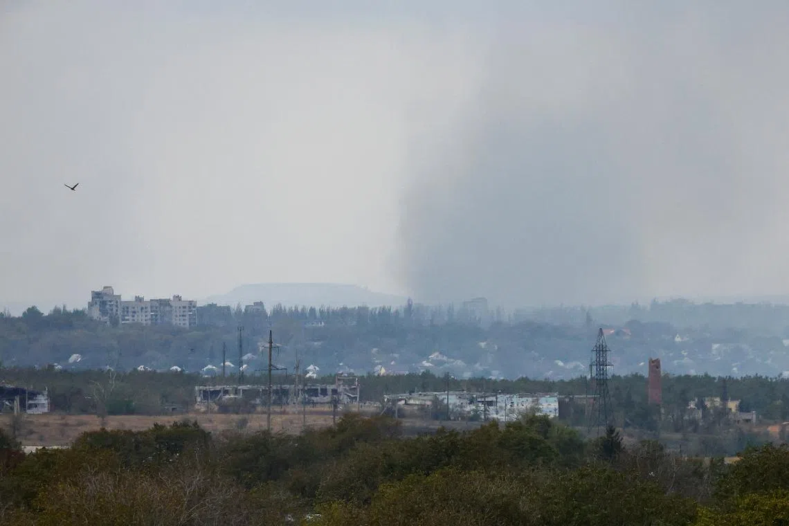 FILE PHOTO: Smoke rises above the area of Avdiivka town in the course of Russia-Ukraine conflict, as seen from Yasynuvata (Yasinovataya) in the Donetsk region, Russian-controlled Ukraine, October 13, 2023. REUTERS/Alexander Ermochenko/File Photo