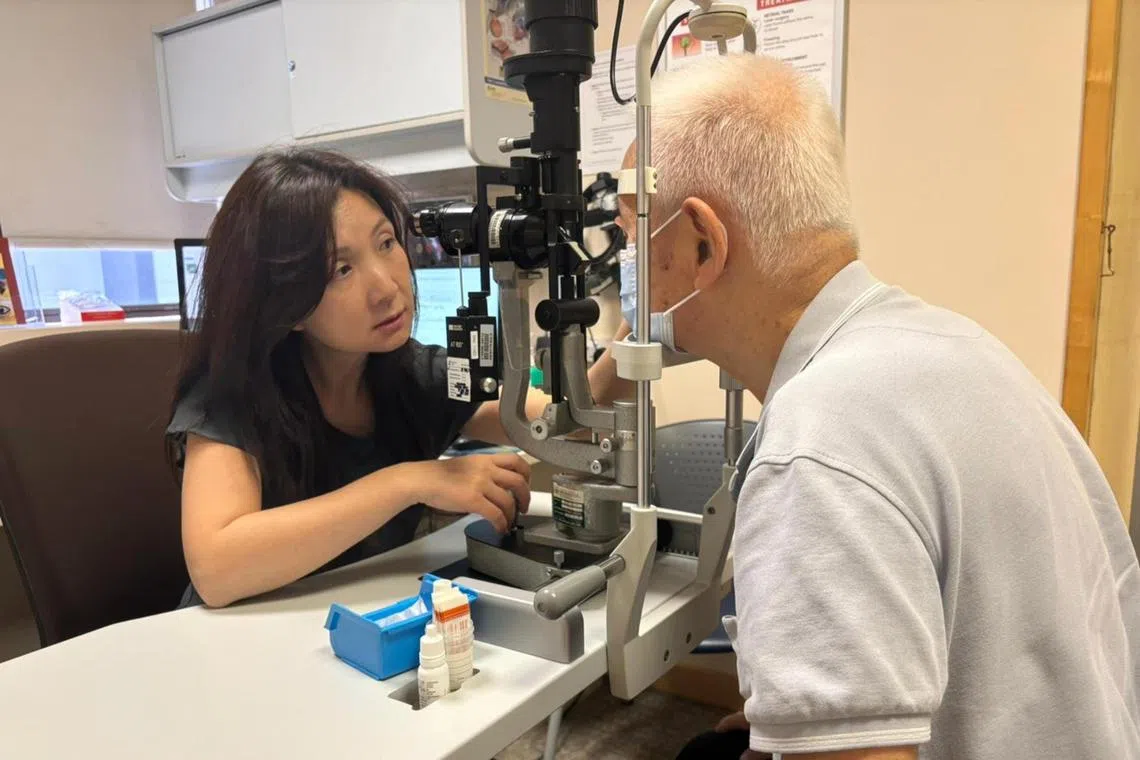 Professor Gemmy Cheung,  who the director for clinical translational research at SERI is conducting an eye examination on a patient to check his overall eye health.