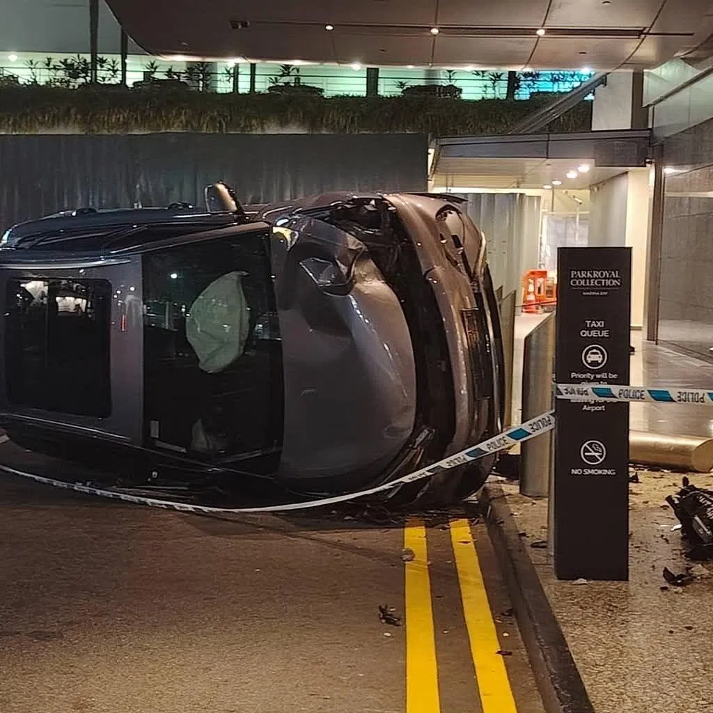 An image uploaded on the Taxi Drivers Singapore Facebook group shows a car flipped on its side.