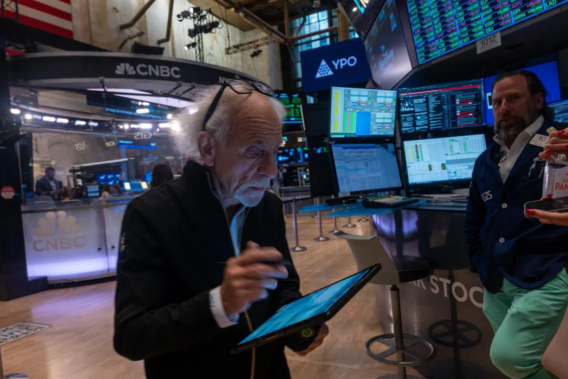 Traders working on the floor of the New York Stock Exchange on Aug 22, in New York City.