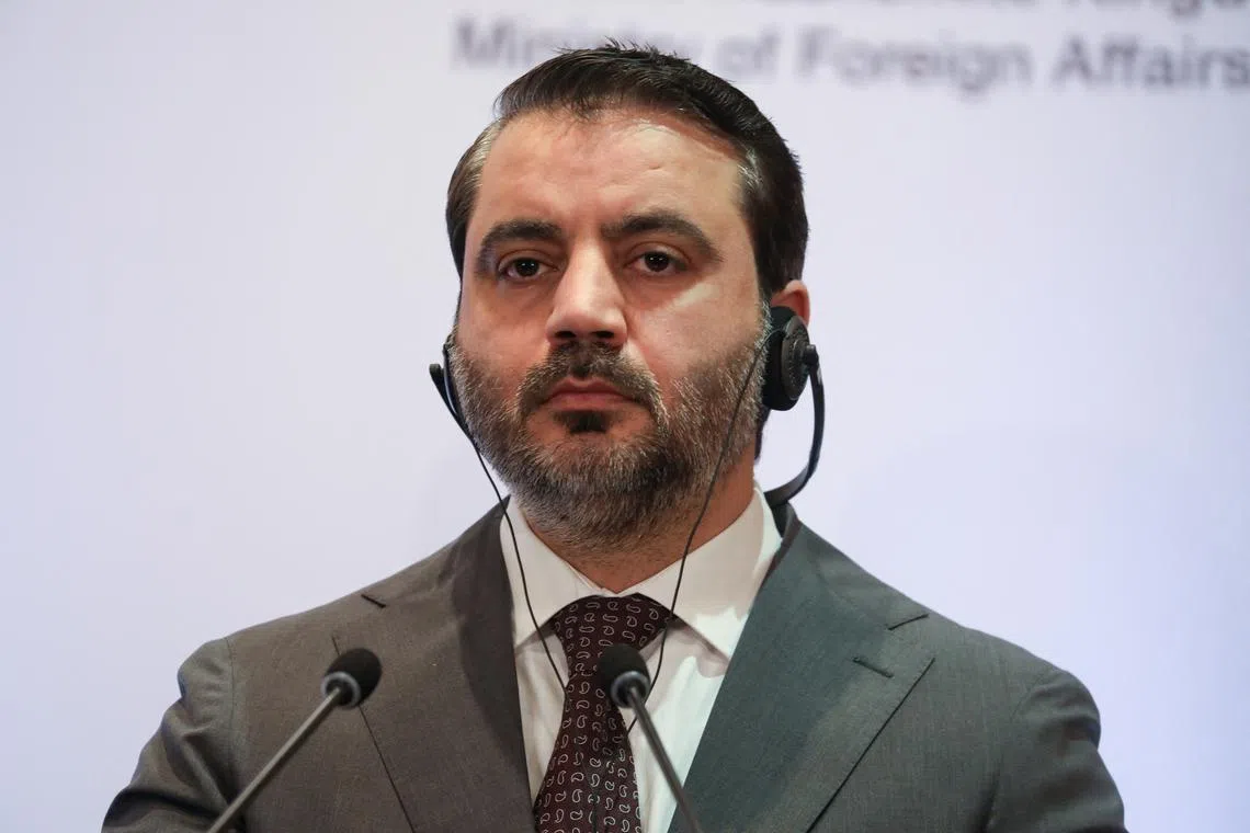 FILE PHOTO: Syrian Foreign Minister Asaad Hassan al-Shibani attends a press conference after a meeting of delegations from Turkey, Jordan, Syria, Lebanon and Iraq, in Amman, Jordan, March 9, 2025. REUTERS/Alaa Al Sukhni/File Photo