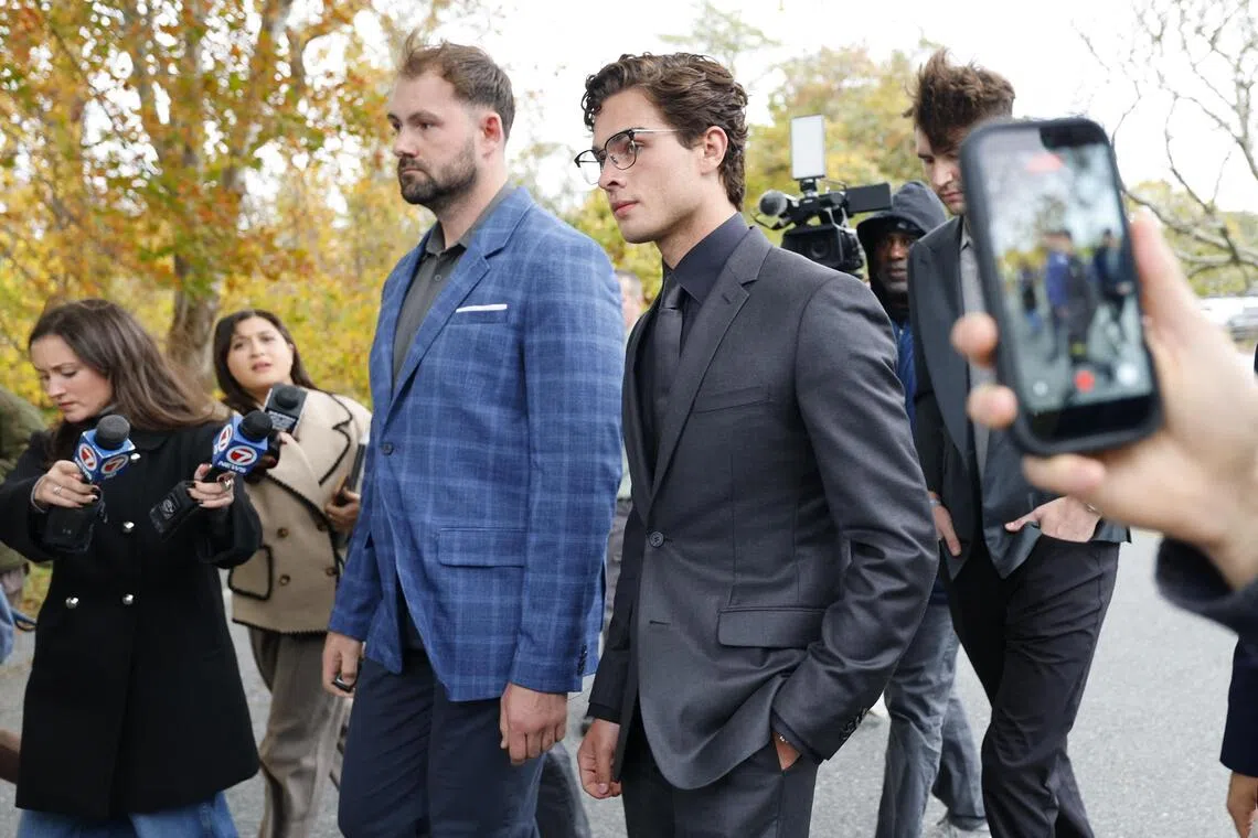 Defendant Braden Eric Peters - known online as Clavicular (centre right) - leaving court on Oct 22, in Orleans, Massachusetts.
