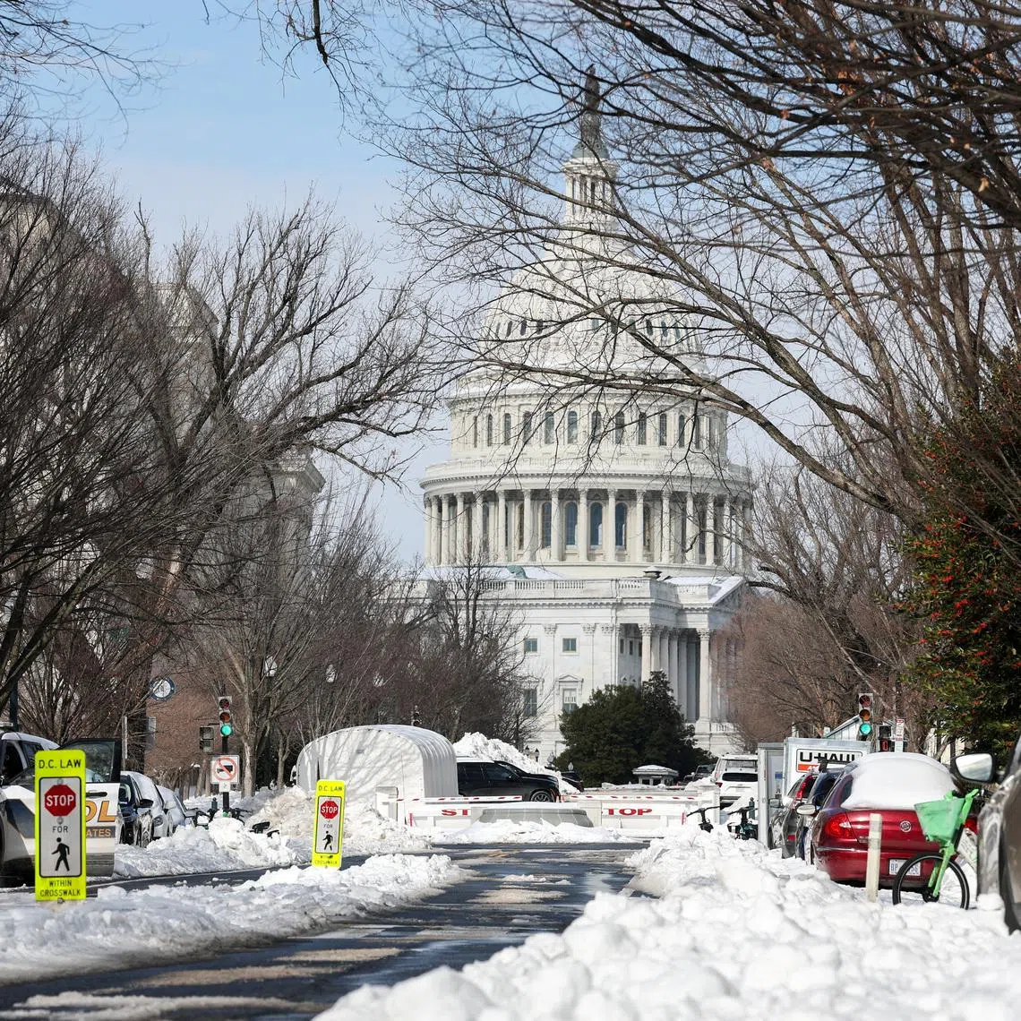 Snow covers a street near the US Capitol building in Washington on Jan 27, two days after a winter storm swept across a large swathe of the US.
