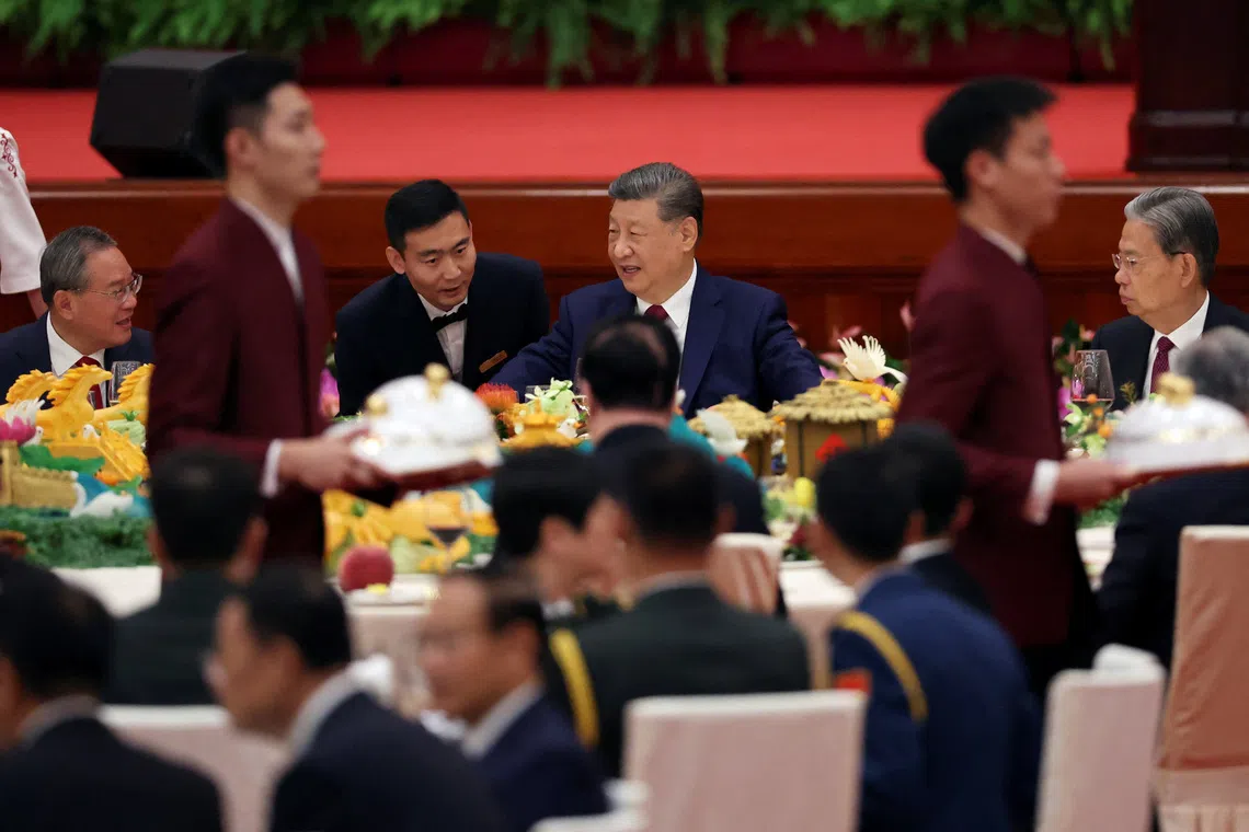 China's Xi talks economy, Taiwan at reception marking National Day