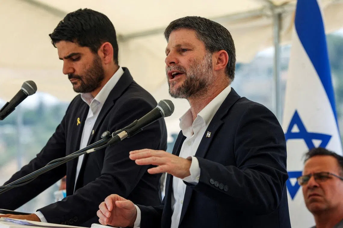 FILE PHOTO: Israeli Finance Minister Bezalel Smotrich speaks at a press conference regarding settlements expansion for the long-frozen E1 settlement, that would split East Jerusalem from the occupied West Bank, near the Israeli settlement of Maale Adumim in the Israeli-occupied West Bank, August 14, 2025. REUTERS/Ronen Zvulun/File Photo