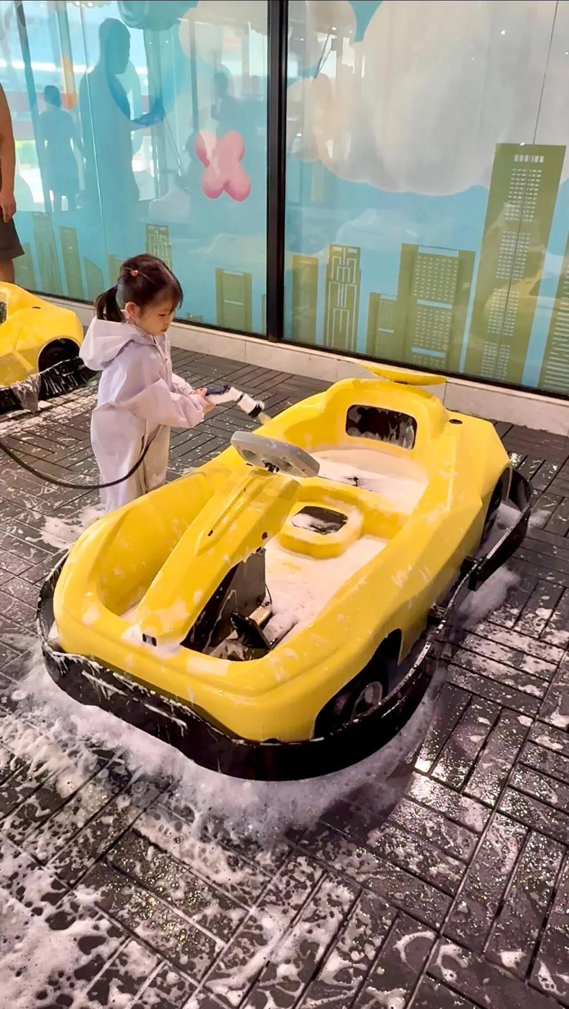 Low Liqi’s daughter Abby enjoys visiting the VroomTown Driving City at Marina Square.