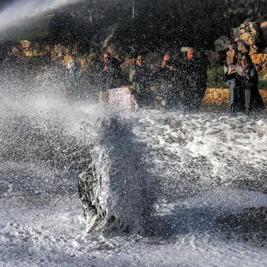 Israeli security forces use water cannon to disperse protesters that had gathered outside the Knesset, the Israeli Parliament, in Jerusalem on March 31, 2026.