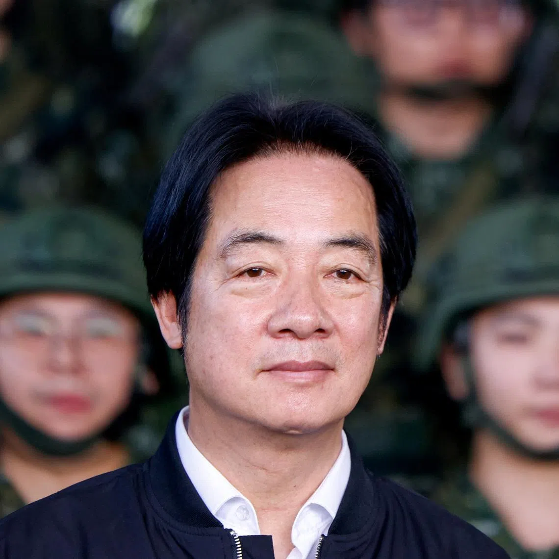 FILE PHOTO: Taiwan President Lai Ching-te poses for photo after inspecting reservists operating a Taiwan made Hummer 2 Drone during a training session at Loung Te Industrial Parks Service Center in Yilan, Taiwan December 2, 2025. REUTERS/Ann Wang/File Photo