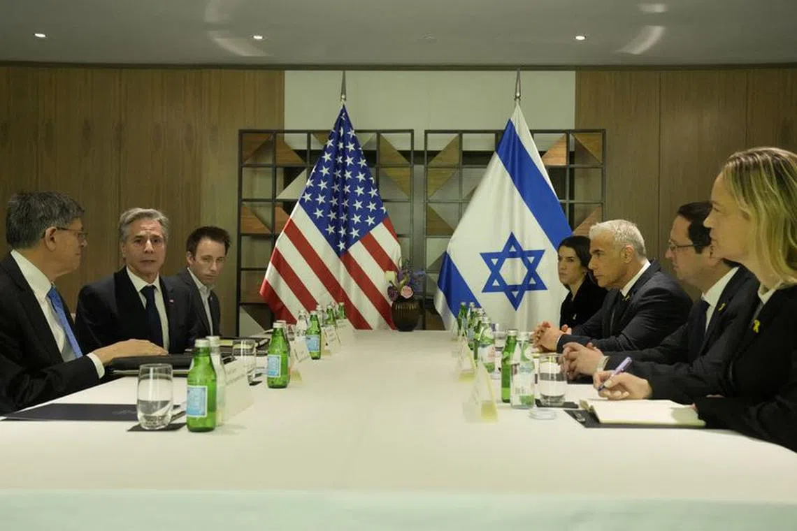 U.S. Secretary of State Antony Blinken meets with Israeli opposition leader Yair Lapid, in Tel Aviv, Israel, Thursday, Feb. 8, 2024. Mark Schiefelbein/Pool via REUTERS