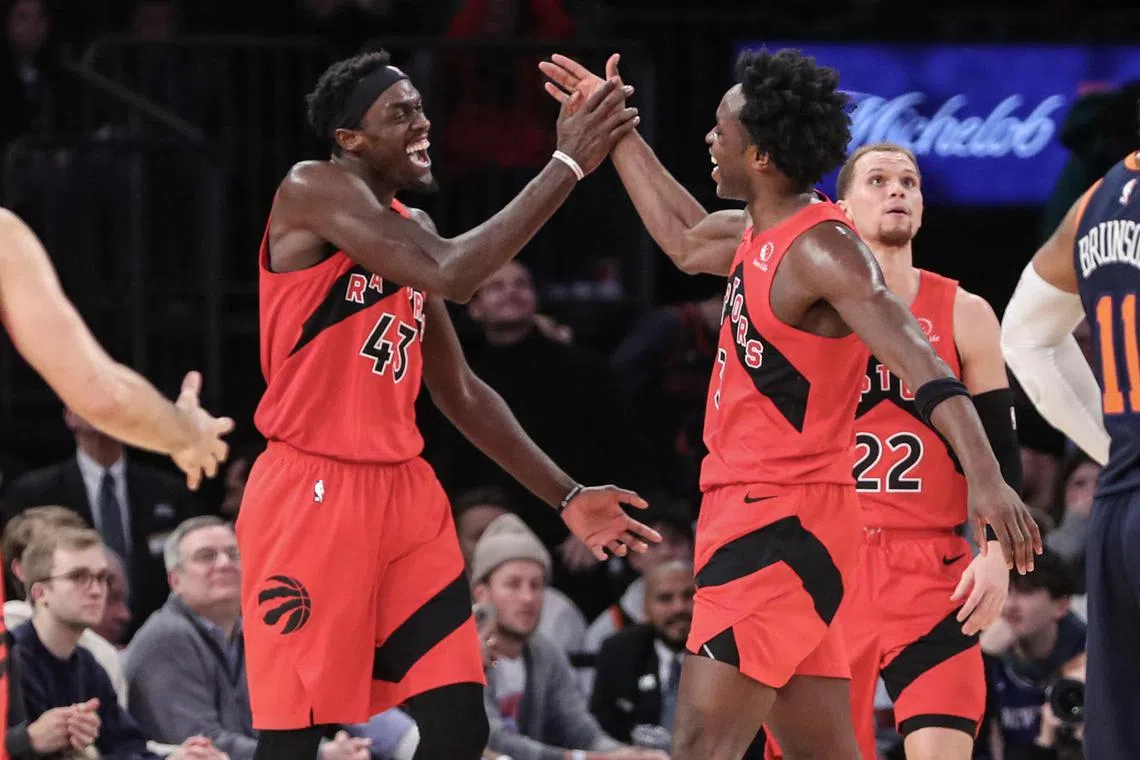 Toronto Raptors forward Pascal Siakam (left) celebrates after scoring with forward OG Anunoby in the fourth quarter against the New York Knicks at Madison Square Garden.