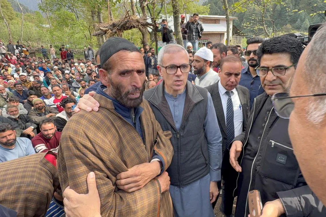 FILE PHOTO: Omar Abdullah, Chief Minister of Jammu and Kashmir, consoles the father of Adil Hussain Shah who was killed in a suspected militant attack near Pahalgam, before the funeral prayers in Hapatnard in south Kashmir's Anantnag district April 23, 2025. REUTERS/Stringer