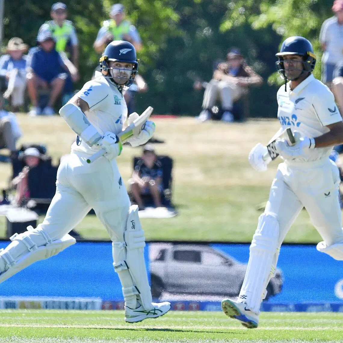 New Zealand's Rachin Ravindra (right) and Tom Latham run between the wickets on day three of the first cricket Test against West Indies at Hagley Oval in Christchurch on Dec 4, 2025. They scored 176 and 145 respectively.