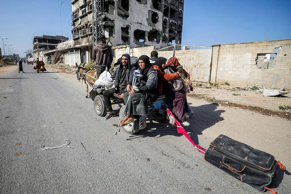 Displaced Palestinians on the move after fleeing the northern part of Gaza amid an Israeli military operation, in Gaza City, Nov 12, 2024. 