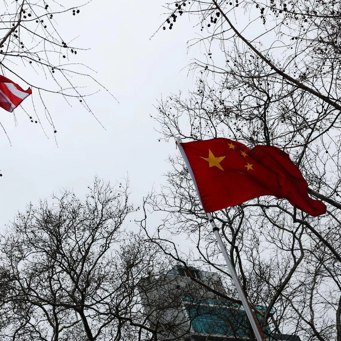 The flags of the United States and China wave in the wind during Lunar New Year celebrations welcoming the Year of the Horse, in New York City, U.S., February 17, 2026. REUTERS/Shannon Stapleton
