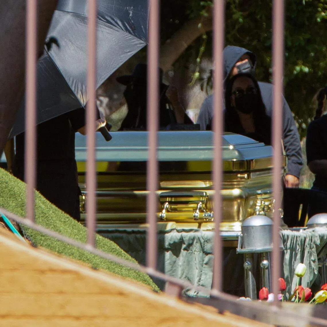 People gather next to a golden casket where the body of cartel leader Nemesio Oseguera Cervantes, known as "El Mencho," lies after he was killed on Febr 22 in a military operation.
