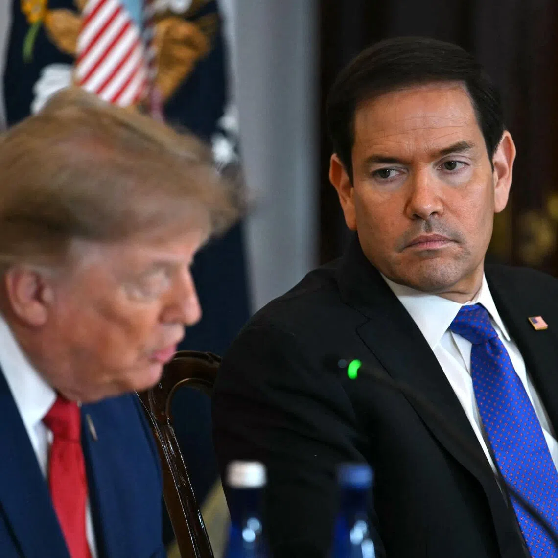 US Secretary of State Marco Rubio (right) listening as US President Donald Trump speaks during a roundtable event in Washington, DC, on Aug 7.