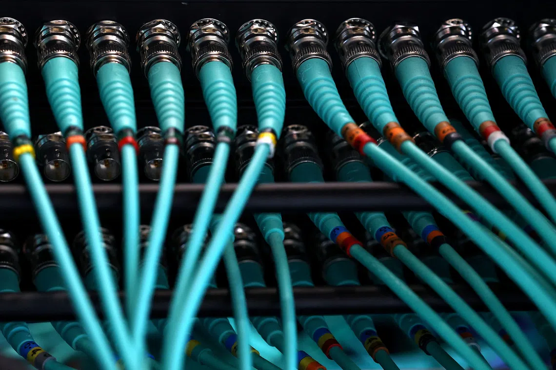 A photo illustration shows cables at a computer server, as cyber agencies warn that websites may be taken offline while PHP prepares a critical fix, in Berlin, Germany, October 22, 2026. REUTERS/Lisi Niesner
