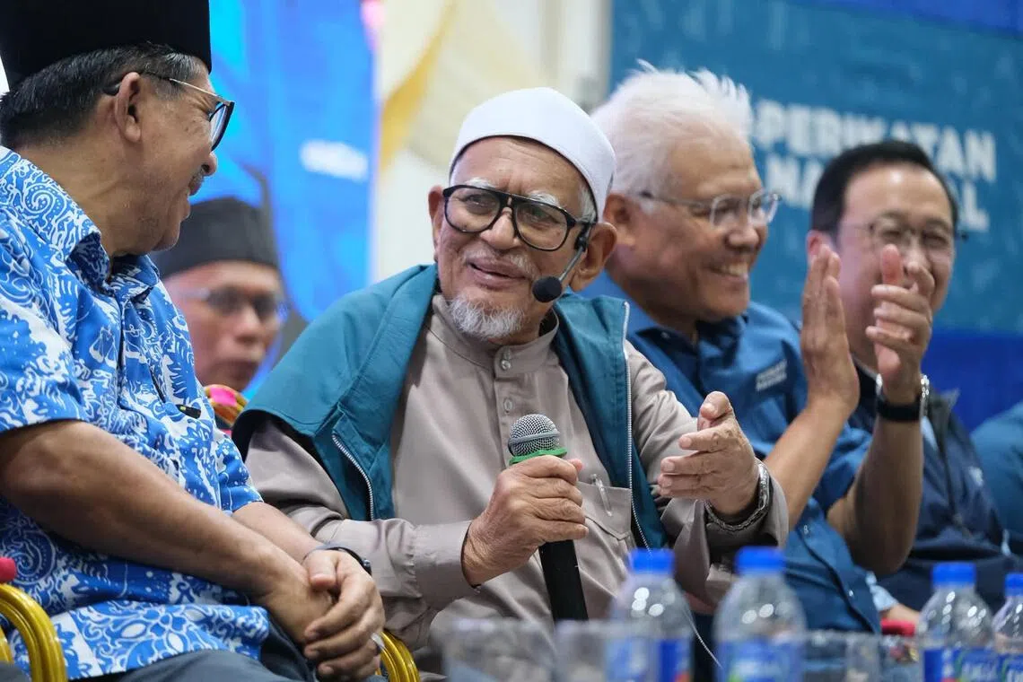 PAS president Hadi Awang (second from left) and Wawasan Negara president Hamzah Zainudin (second from right) at a Perikatan Nasional - Barisan Nasional campaign rally in Negeri Sembilan, July 30, 2026.
