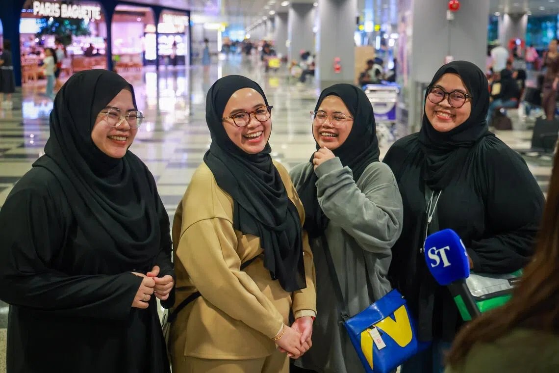 (From left) Sisters Dahlyanna Khairuddin, 29; Dyana, 34; Dahlya, 32; Dhaniya, 27, speaking to ST after coming back from Jakarta on flight SQ959, at Changi Airport Terminal 3, on Sep 8.