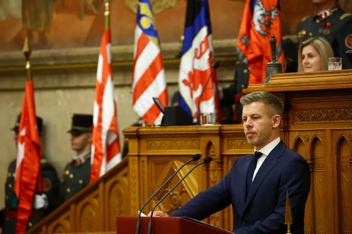 Hungarian Prime Minister Peter Magyar delivers a speech on the day new members of government take their oath of office in the Parliament, in Budapest, Hungary, May 12, 2026. REUTERS/Bernadett Szabo