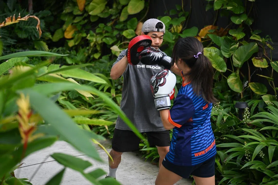 Kelly (not her real name) training with her coach Allan Ng at the Foundry on May 29.