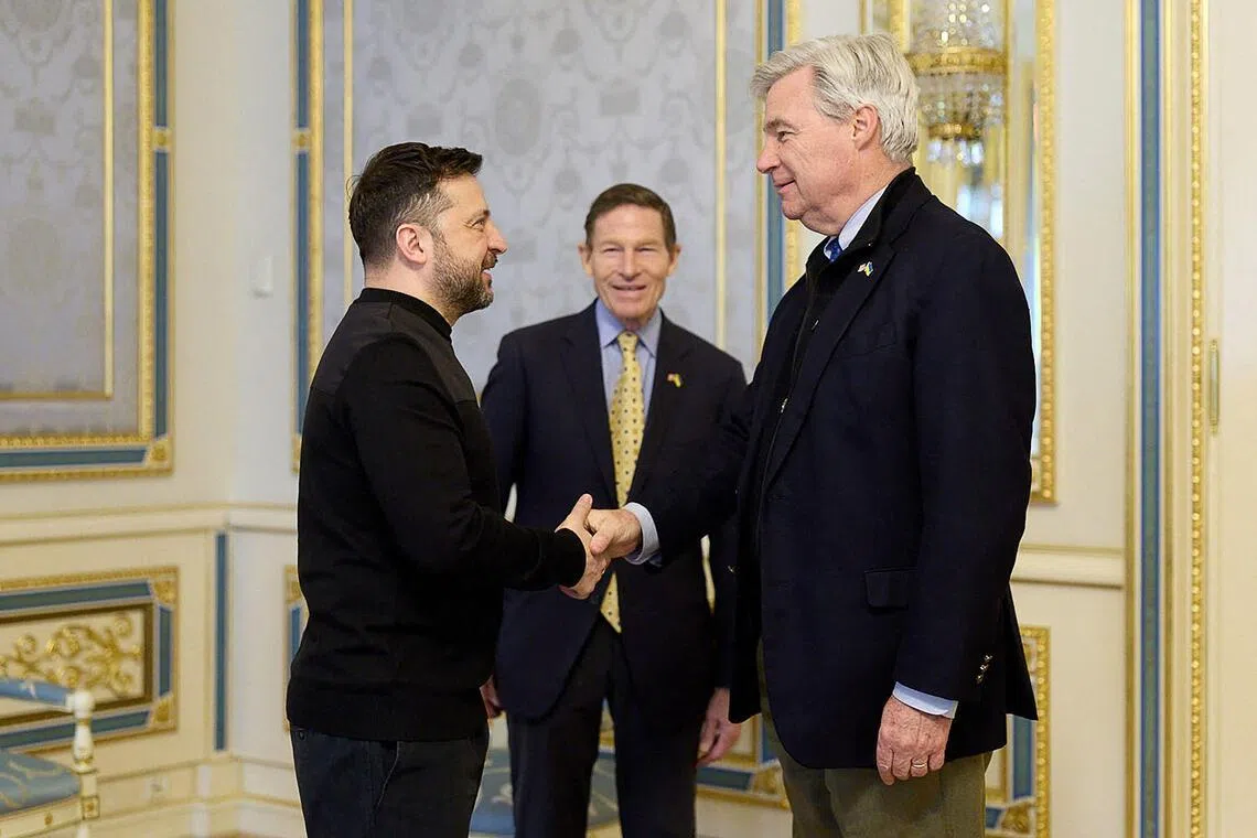 Ukrainian President Volodymyr Zelensky (left) welcoming US Senators Richard Blumenthal (centre) and Sheldon Whitehouse to Kyiv on Feb 16.