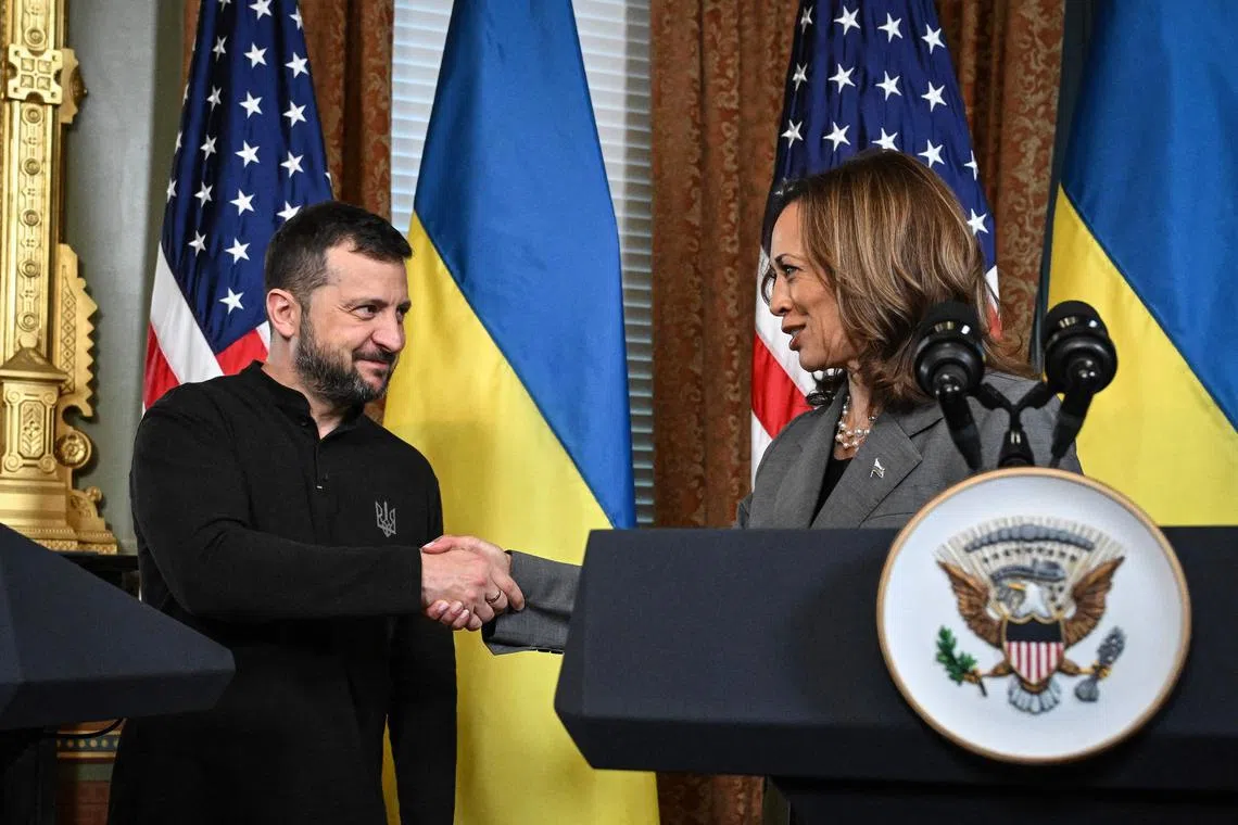 US Vice-President and Democratic presidential candidate Kamala Harris (right) and Ukrainian President Volodymyr Zelensky shaking hands after speaking to the press before a private meeting, on Sept 26.