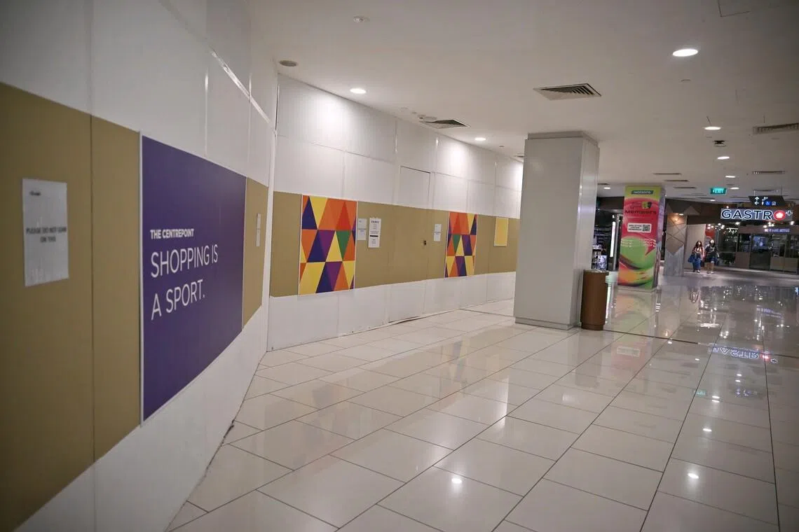 Hoardings and
 for-rent signs at
 The Centrepoint
shopping mall on
 Feb 18.
