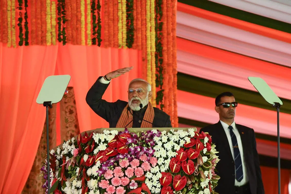 India’s Prime Minister Narendra Modi speaks during a rally, as his bodyguard looks on at the Bakshi Stadium in Srinagar, March 7, 2024. REUTERS/Stringer/File Photo