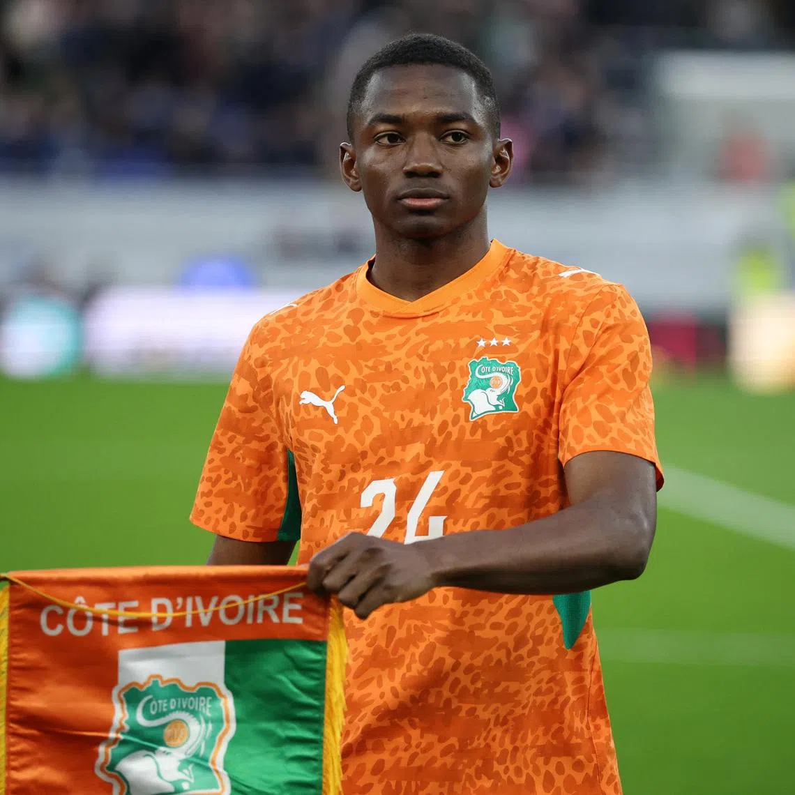 Soccer Football - International Friendly - Scotland v Ivory Coast - Hill Dickinson Stadium, Liverpool, Britain- March 31, 2026  Ivory Coast's Bazoumana Toure holds a pennant before the match REUTERS/Phil Noble