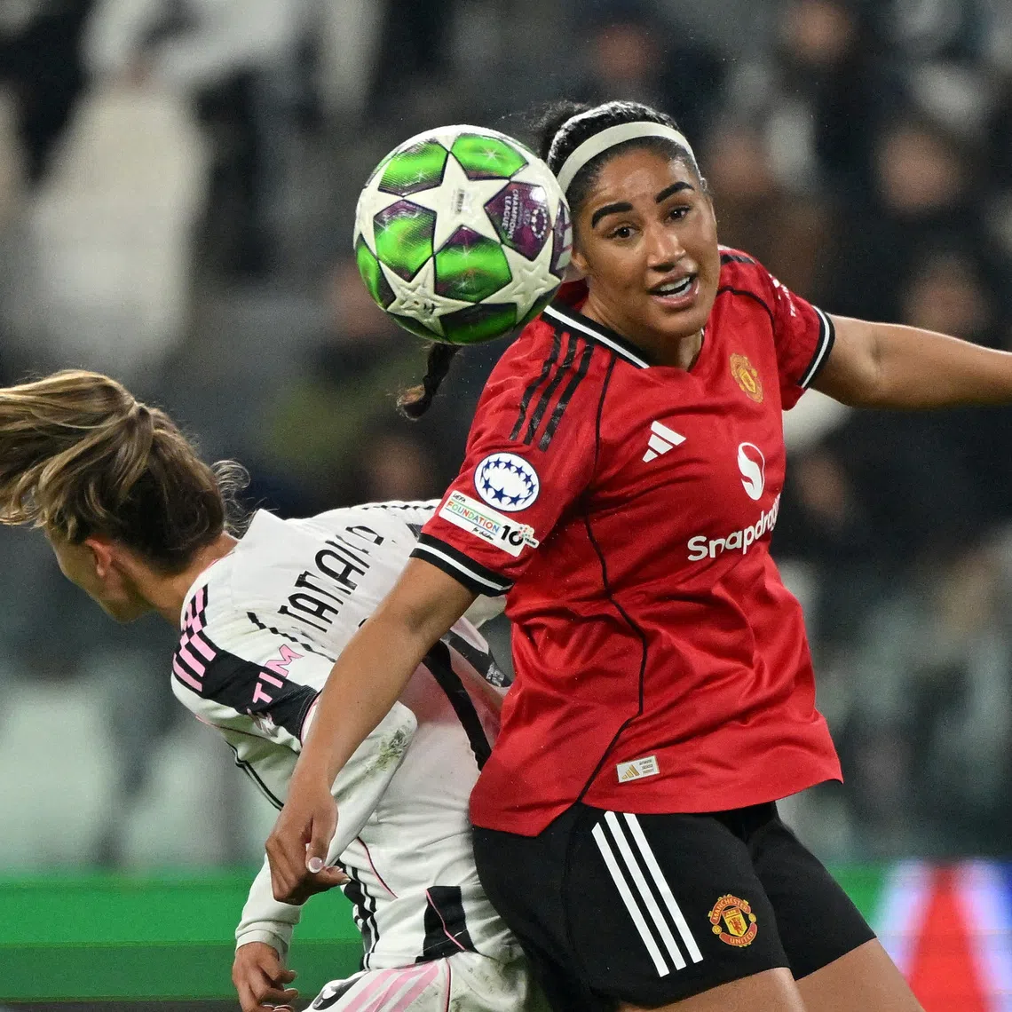 FILE PHOTO: Soccer Football - Women's Champions League - Juventus v Manchester United - Allianz Stadium, Turin, Italy - December 17, 2025 Manchester United's Gabby George in action REUTERS/Alberto Lingria/File Photo