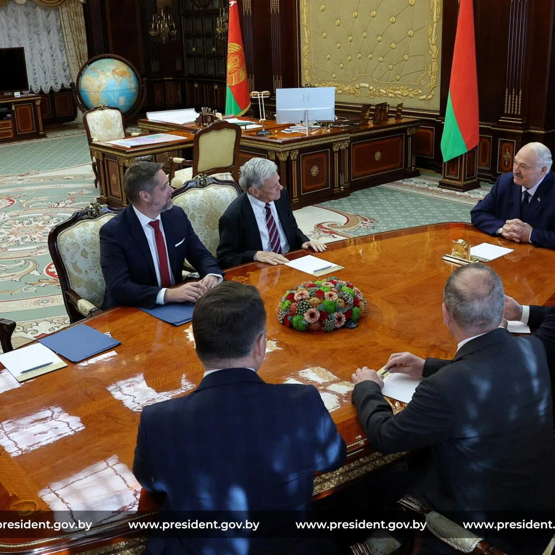 Members of the delegations, led by Belarusian President Alexander Lukashenko and U.S. presidential envoy John Coale, hold talks in Minsk, Belarus, March 19, 2026. President of the Republic of Belarus/Handout via REUTERS