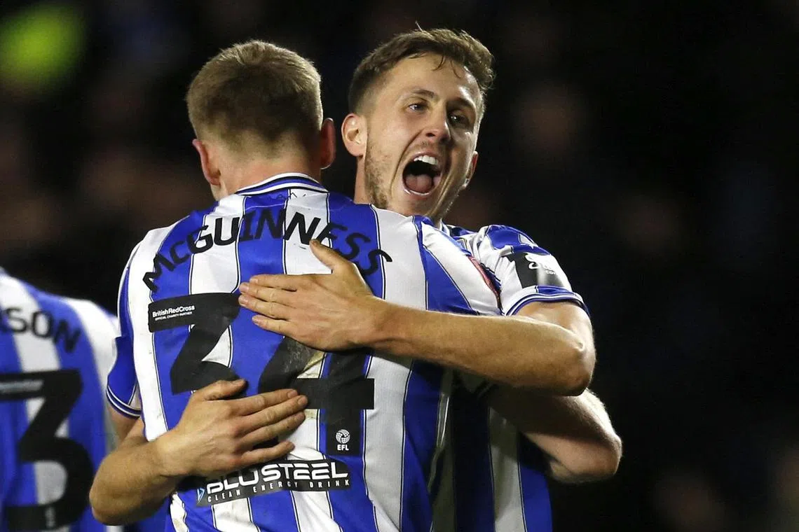 Sheffield Wednesday's Will Vaulks and Mark McGuinness celebrate after the match.