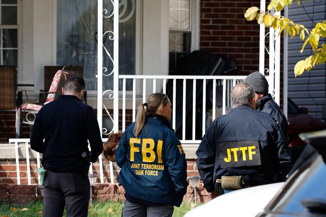 FBI agents searching a home in Dearborn, Michigan, on Oct 31.