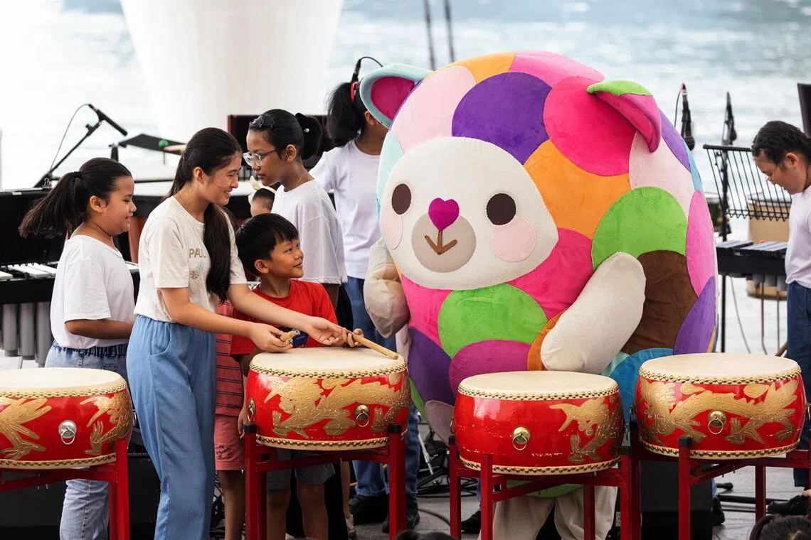 Esplanade’s children’s mascot Pip with festival-goers at the 2024 edition of Octoburst!
