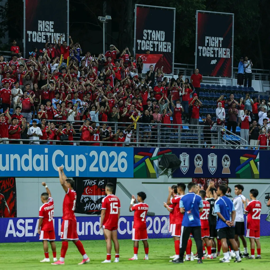 Lions fans cheering on the team after the ASEAN Championship Group A match against Indonesia at Jalan Besar Stadium on Aug 7.