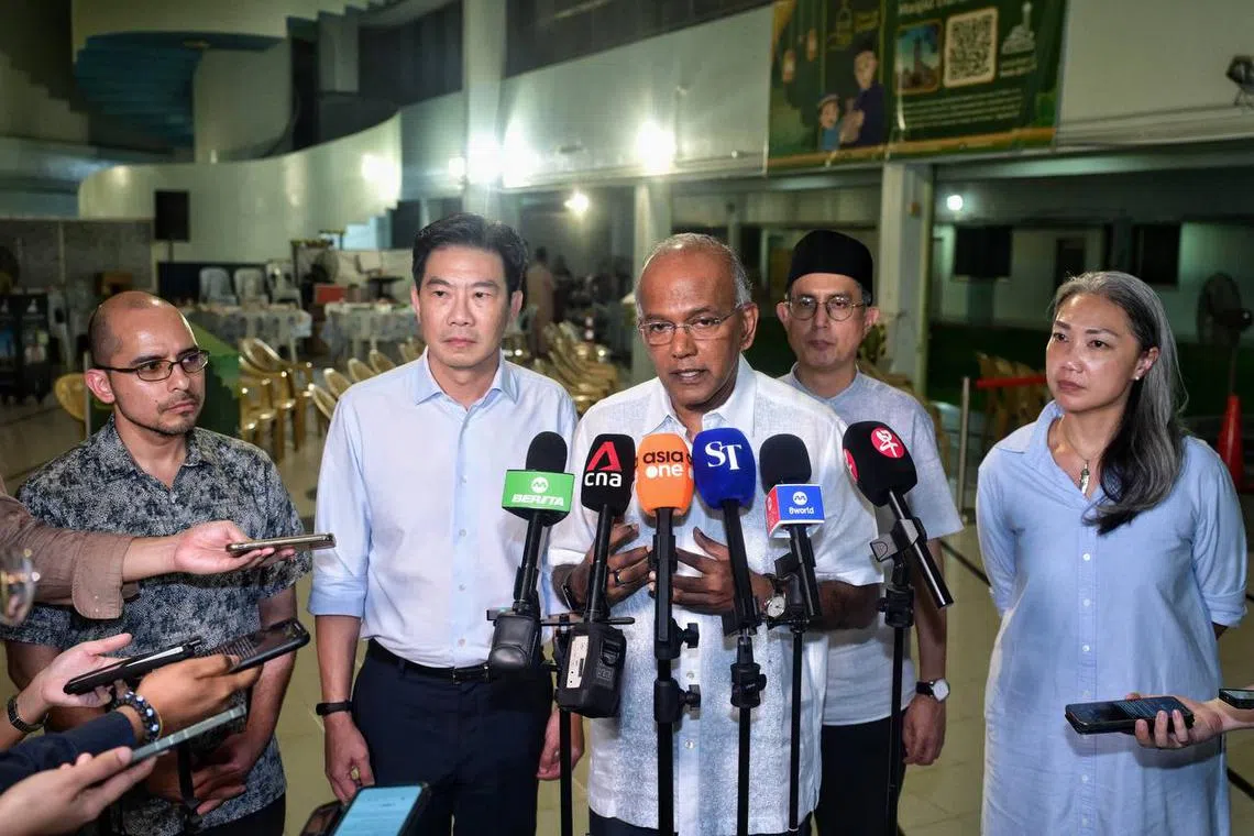 Law and Home Affairs Minister K Shanmugam (centre), with (from left) Nee Soon Advisers Derrick Goh, Syed Harun Alhabsyi, Faishal Ibrahim, and Carrie Tan, speaking to the media during a doorstop on March 26.