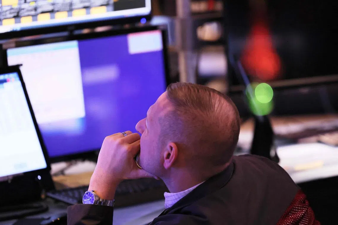 Traders work on the floor of the New York Stock Exchange.