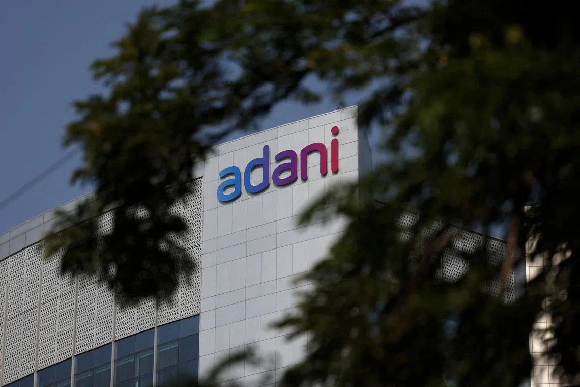 FILE PHOTO: The logo of the Adani Group is seen on the facade of its Corporate House on the outskirts of Ahmedabad, India, November 21, 2024. REUTERS/Amit Dave/File Photo
