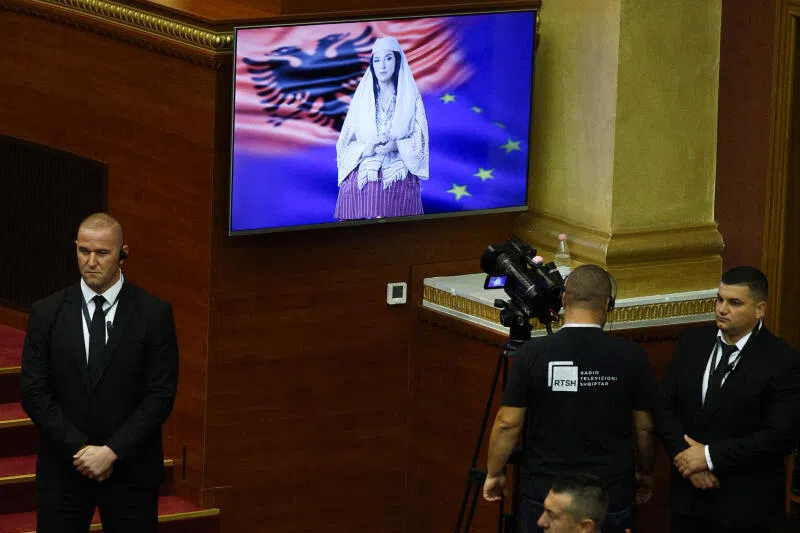 Albania's AI-generated minister "Diella"  insisting its role is to help people not replace them, during its first appearance in Parliament in September. 