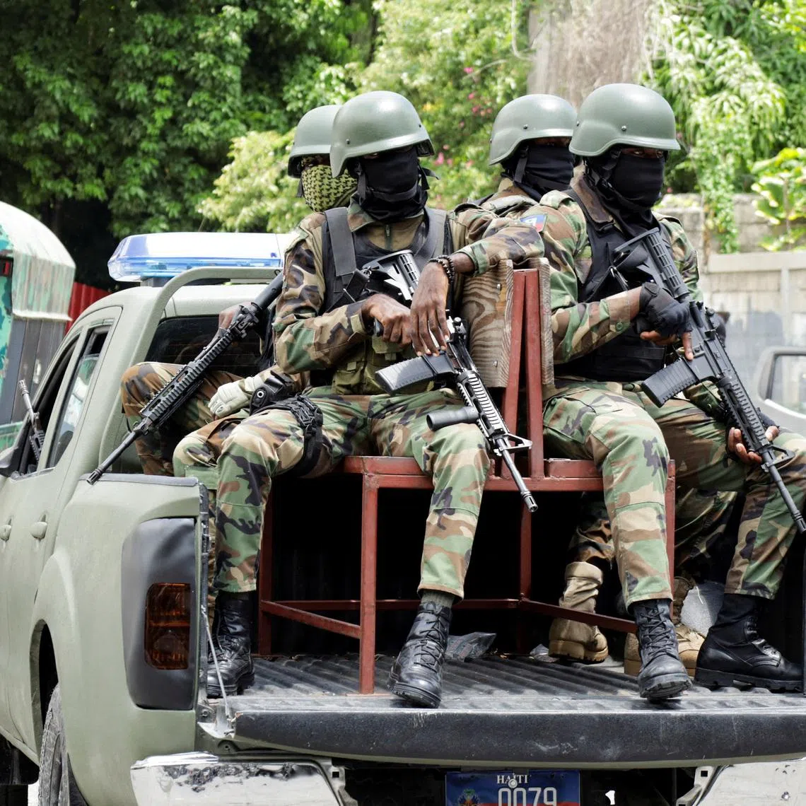 FILE PHOTO: Haitian soldiers keep a watch outside the venue where businessman Laurent Saint-Cyr is set to be designated as president of Haiti's Transitional Presidential Council (CPT), in Port-au-Prince, Haiti, August 7, 2025. REUTERS/Fildor Pq Egeder/File Photo