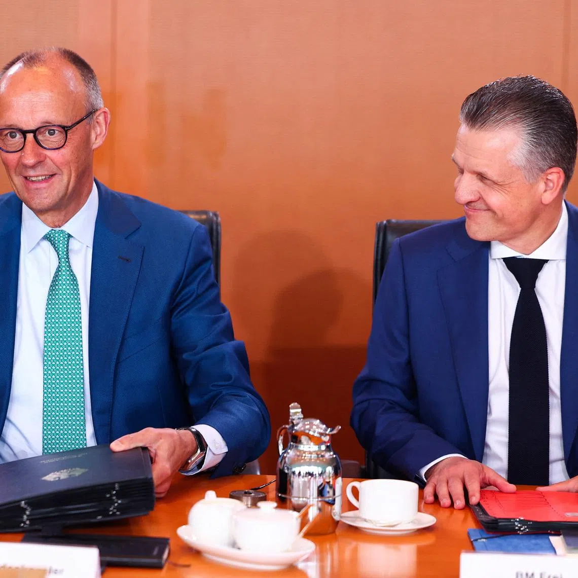 German Chancellor Friedrich Merz and Minister for Special Tasks and Head of the Federal Chancellery Thorsten Frei react at a cabinet meeting at the Chancellery in Berlin, Germany, July 22, 2026. REUTERS/Christian Mang
